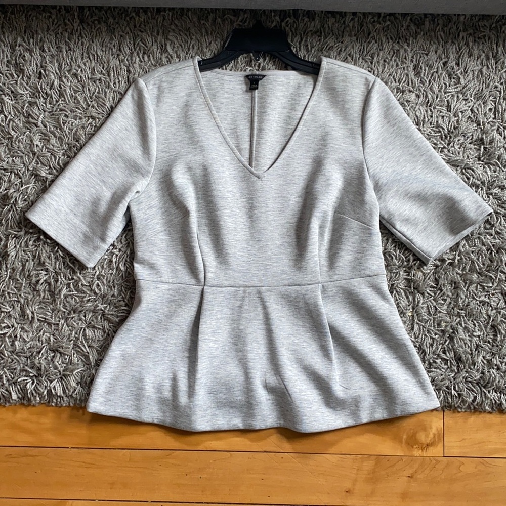 Lightly used Ann Taylor Heather Gray Peplum Top.